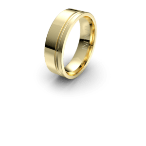 A shiny gold wedding band casting a shadow.