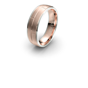 Rose gold wedding band with engraved pattern.