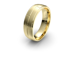 Gold wedding band with engraved lines.